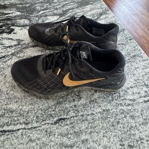 Nike Black Sneakers with Gold Swoosh